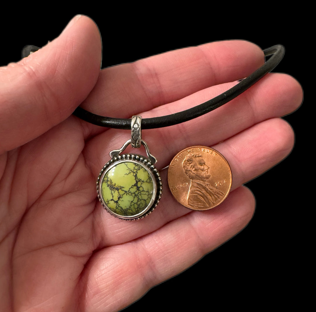 Green turquoise necklace shown next to a penny for scale.