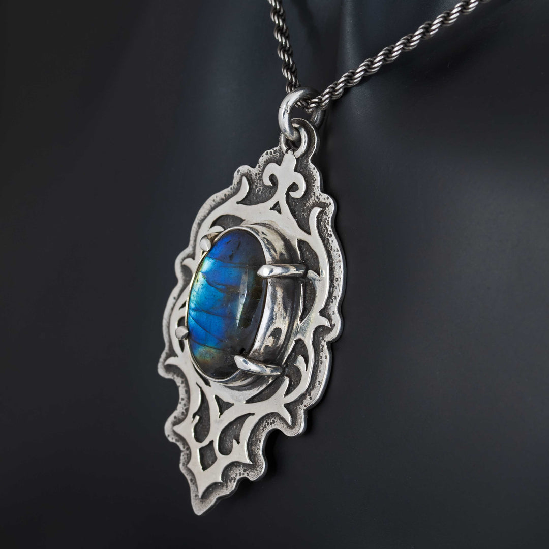 Side angle of gothic labradorite necklace revealing dimensional silver framework and stone depth
