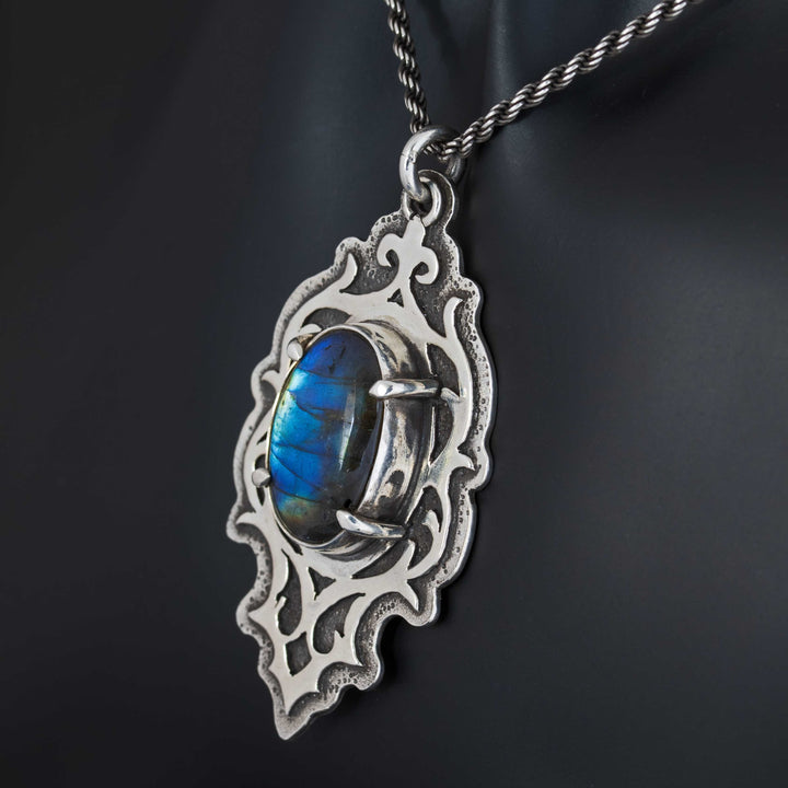 Side angle of gothic labradorite necklace revealing dimensional silver framework and stone depth