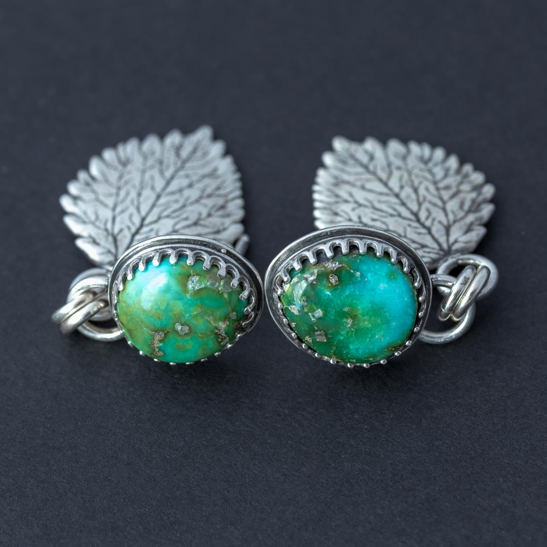 Handmade Sonoran Gold turquoise earrings with sterling silver aspen leaf dangles, front view.