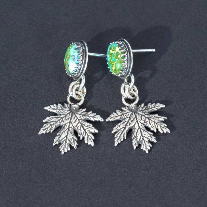 Handmade Sonoran Gold turquoise earrings with sterling silver maple leaf dangles, front view